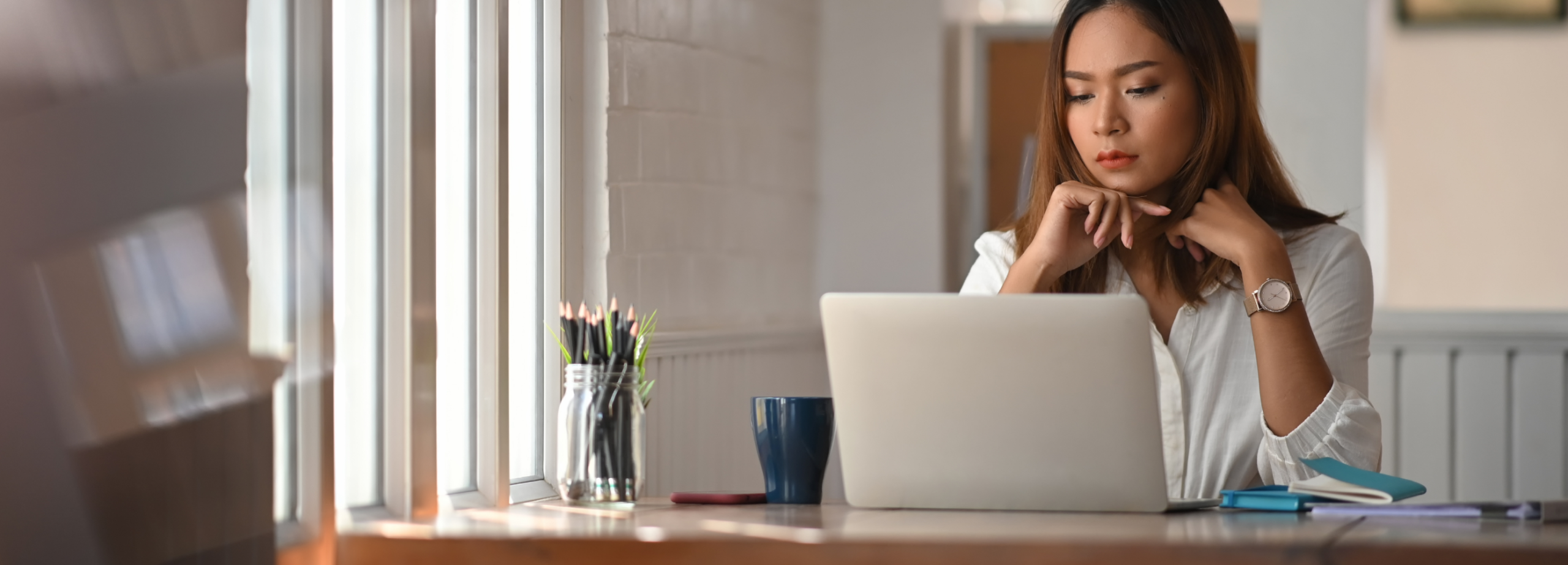 Woman taking note of when borrowing from licensed money lenders in Singapore