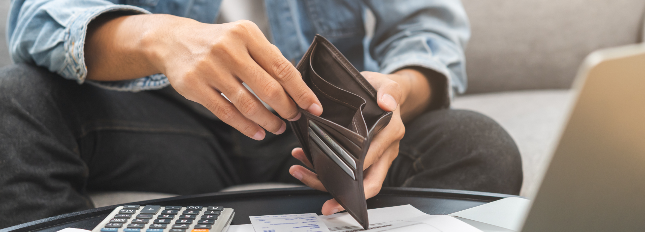 a man checking empty wallet