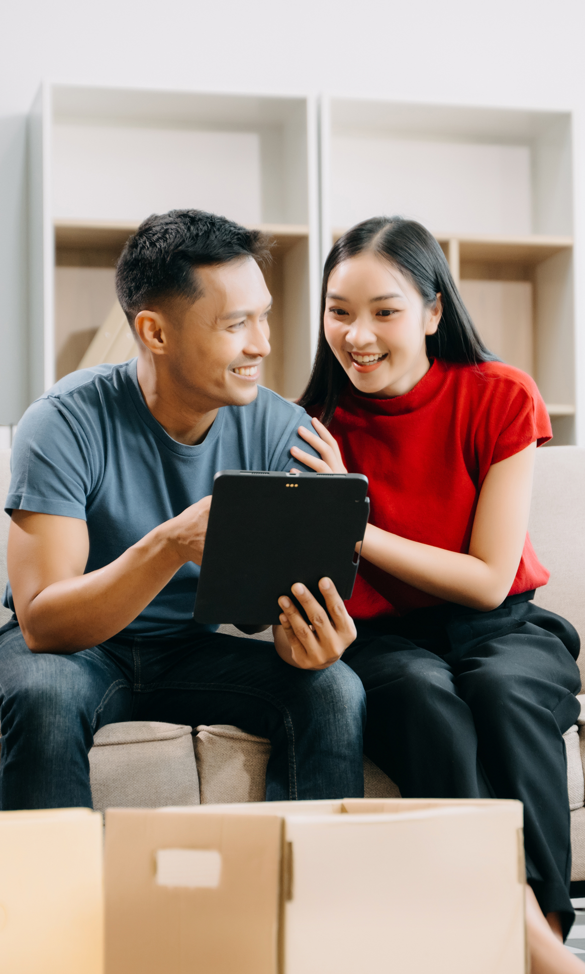 asian couple happy checking the renovation loan